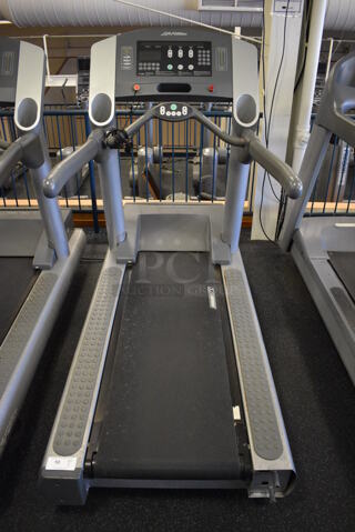 NICE! Life Fitness Model 95Ti Metal Heavy Duty Commercial Floor Style Treadmill w/ Heart Rate Sensors. 120 Volts, 1 Phase. BUYER MUST REMOVE. 36x84x65. Tested and Working! (upstairs) This Unit Will Be Moved Down To The First Floor Before Pick Up Day Begins!