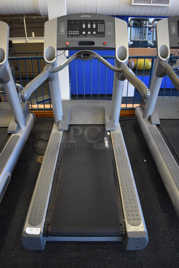 NICE! Life Fitness Model 95T Metal Heavy Duty Commercial Floor Style Treadmill w/ Heart Rate Sensors and Cup Holders. 120 Volts, 1 Phase. BUYER MUST REMOVE. 36x84x65. Tested and Working! (upstairs) This Unit Will Be Moved Down To The First Floor Before Pick Up Day Begins! - Image 1 of 8