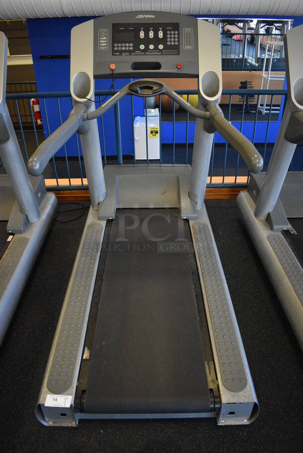 NICE! Life Fitness Model 95T Metal Heavy Duty Commercial Floor Style Treadmill w/ Heart Rate Sensors and Cup Holders. 120 Volts, 1 Phase. BUYER MUST REMOVE. 36x84x65. Tested and Working! (upstairs) This Unit Will Be Moved Down To The First Floor Before Pick Up Day Begins!