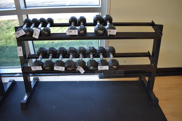 Black Metal 2 Tier Dumbbell Rack. Does Not Include Contents. BUYER MUST REMOVE. 58x21x32. (aerobic room)