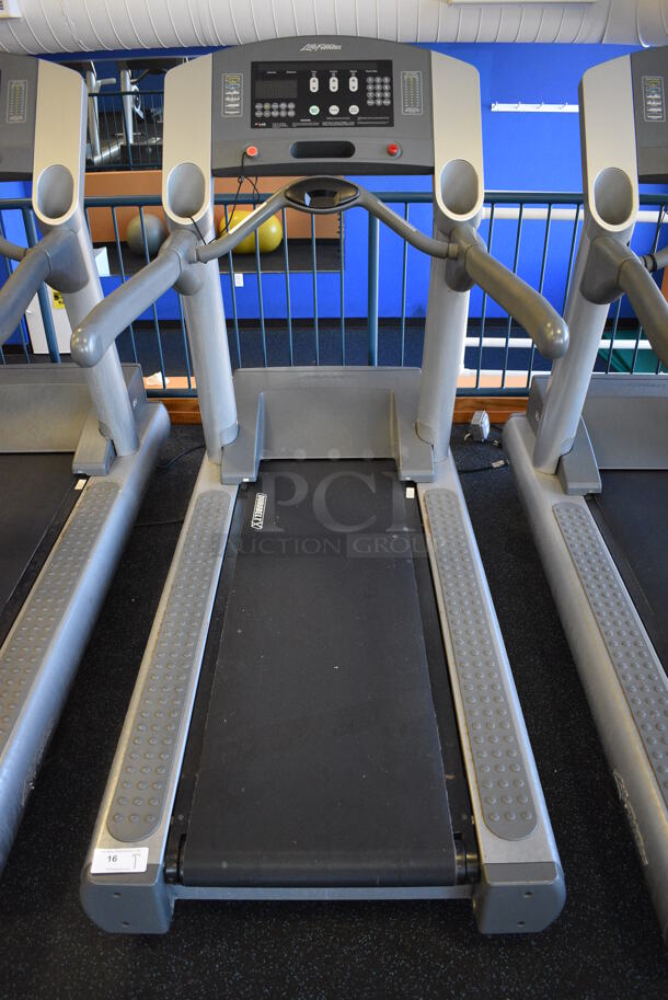 NICE! Life Fitness Model 95T Metal Heavy Duty Commercial Floor Style Treadmill w/ Heart Rate Sensors and Cup Holders. 120 Volts, 1 Phase. BUYER MUST REMOVE. 36x84x65. Tested and Working! (upstairs) This Unit Will Be Moved Down To The First Floor Before Pick Up Day Begins!