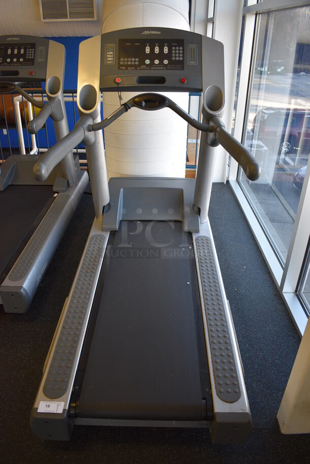 NICE! Life Fitness Model 95Ti Metal Heavy Duty Commercial Floor Style Treadmill w/ Heart Rate Sensors and Cup Holders. 120 Volts, 1 Phase. BUYER MUST REMOVE. 36x84x65. Tested and Working! (upstairs) This Unit Will Be Moved Down To The First Floor Before Pick Up Day Begins! - Image 1 of 8