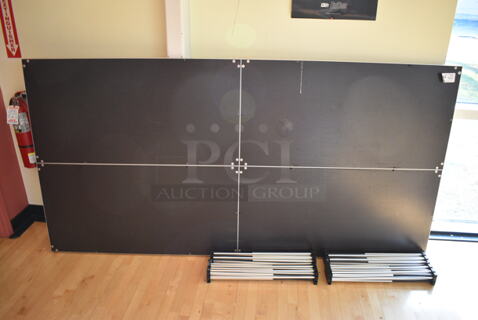 Black Stage w/ 4 Metal Accordion Style Legs. 96x48x2, 25.5" Legs. (aerobic room)
