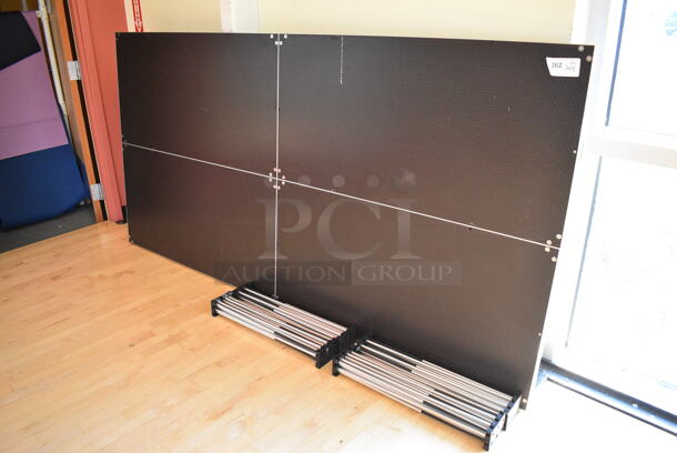 Black Stage w/ 4 Metal Accordion Style Legs. 96x48x2, 25.5" Legs. (aerobic room) - Image 3 of 5