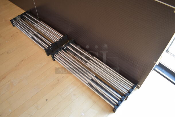 Black Stage w/ 4 Metal Accordion Style Legs. 96x48x2, 25.5" Legs. (aerobic room) - Image 4 of 5