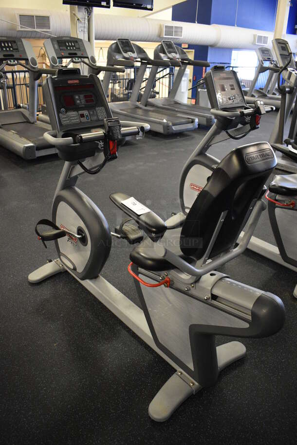 GREAT! Star Trac Pro Model 9-6430-SINTPO Metal Floor Style Seated Stationary Bicycle w/ Heart Rate Sensors, 2 Cup Holders and Arm Rests. BUYER MUST REMOVE. 26x65x53. Tested and Working! (upstairs) This Unit Will Be Moved Down To The First Floor Before Pick Up Day Begins!