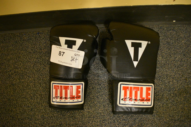 Set of 2 Title Classic Black Boxing Gloves. Includes 6x12x4. (upstairs - side room)
