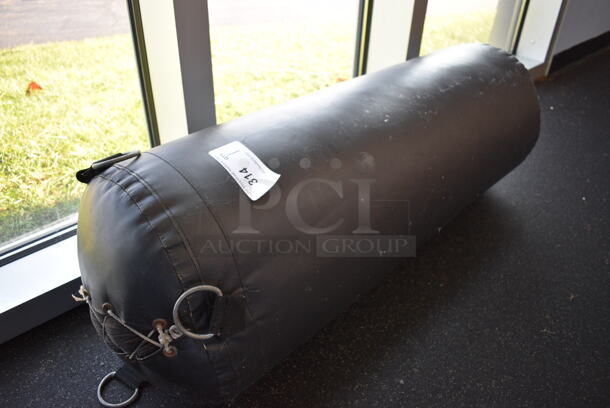 Black Punching Bag. BUYER MUST REMOVE. 14x14x40. (weight room - back room)