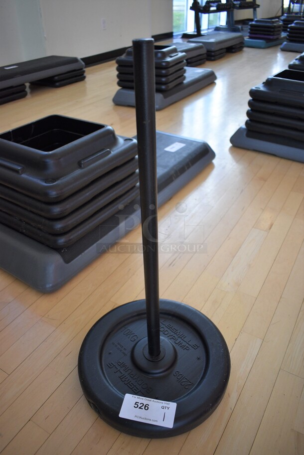 Les Mills Body Pump 22 Pound Weight Plate w/ Pole. BUYER MUST REMOVE. (aerobic room)