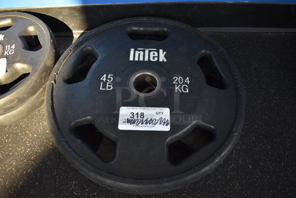 2 Intek Metal 45 Pound Weight Plates. BUYER MUST REMOVE. 17.5x17.5x2. 2 Times Your Bid! (weight room - back room)

