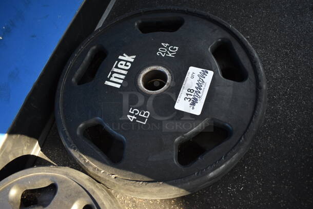 2 Intek Metal 45 Pound Weight Plates. BUYER MUST REMOVE. 17.5x17.5x2. 2 Times Your Bid! (weight room - back room)

 - Image 2 of 2