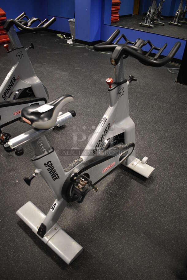 NICE! Star Trac Spinner NXT Metal Commercial Floor Style Upright Stationary Bicycle. BUYER MUST REMOVE. 21x47x45. Tested and Working! (spin cycle room) - Image 1 of 7