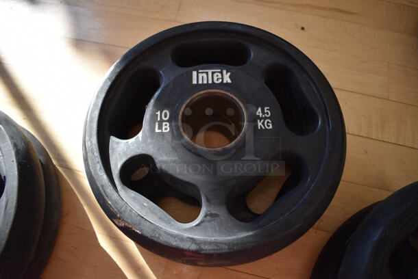 2 Intek Metal 10 Pound Weight Plates. BUYER MUST REMOVE. 2 Times Your Bid! (aerobic room)

