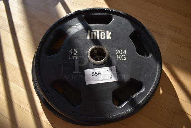 2 Intek Metal 45 Pound Weight Plates. BUYER MUST REMOVE. 2 Times Your Bid! (aerobic room)

