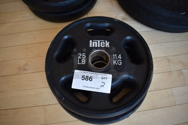 2 Intek Metal 25 Pound Weight Plates. BUYER MUST REMOVE. 2 Times Your Bid! (aerobic room)


