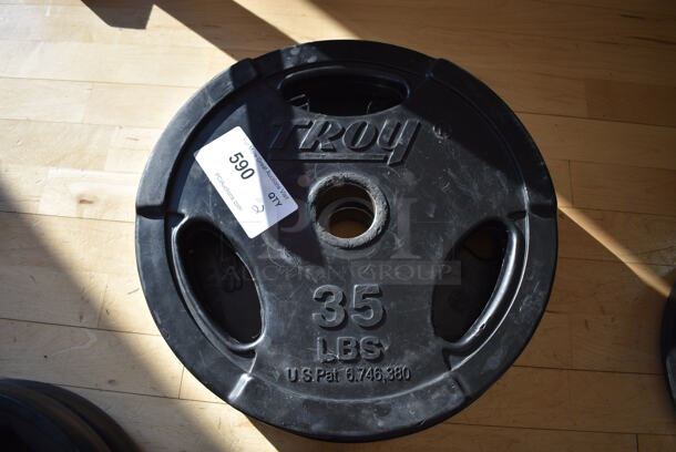 2 Troy Metal 35 Pound Weight Plates. BUYER MUST REMOVE. 2 Times Your Bid! (aerobic room)

