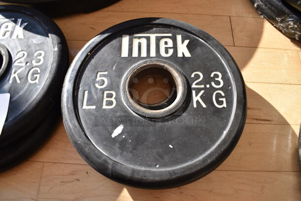 2 Intek Metal 5 Pound Weight Plates. BUYER MUST REMOVE. 2 Times Your Bid! (aerobic room)

