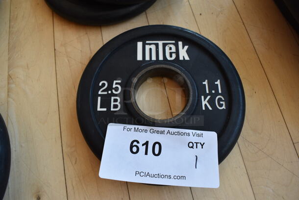 Intek Metal 2.5 Pound Weight Plate. BUYER MUST REMOVE. (aerobic room)


