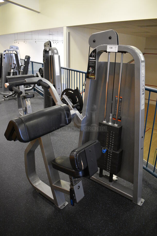 NICE! Precor Metal Commercial Floor Style Tricep Extension Machine. BUYER MUST REMOVE. 46x39x63. (upstairs) This Unit Will Be Moved Down To The First Floor Before Pick Up Day Begins!