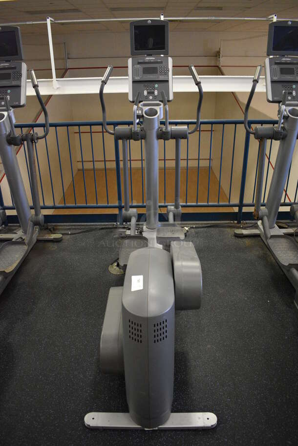 NICE! Precor Model 95xi Experience Metal Floor Style Elliptical Cross Trainer Machine w/ Life Fitness Model LCD-0201 Monitor. BUYER MUST REMOVE. 33x85x75. Tested and Working! (upstairs) This Unit Will Be Moved Down To The First Floor Before Pick Up Day Begins!