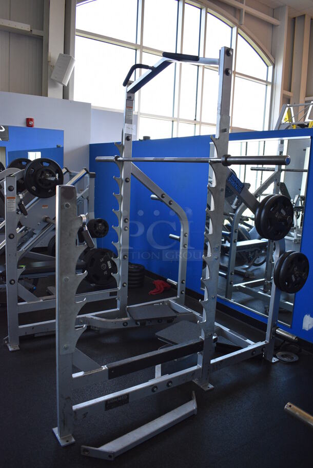 NICE! Hammer Strength Gray Metal Floor Style Squat Rack w/ Olympic Bar. Does Not Include Weight Plates. BUYER MUST REMOVE - Unit May Need Disassembly For Removal. 65x73x91. (weight room) - Image 8 of 9