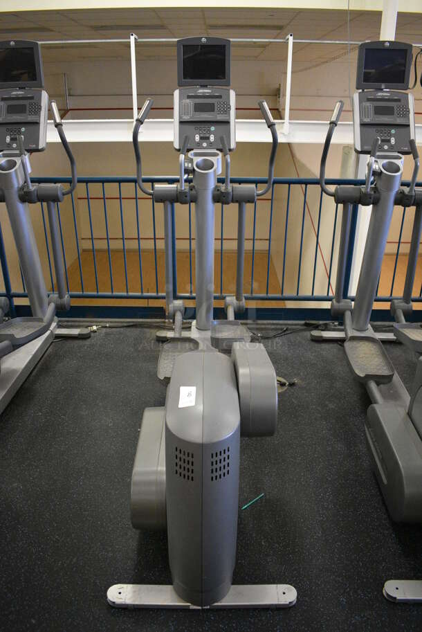 NICE! Precor Model 95xi Experience Metal Floor Style Elliptical Cross Trainer Machine w/ Life Fitness Model LCD-0201 Monitor. BUYER MUST REMOVE. 33x85x75. Tested and Working! (upstairs) This Unit Will Be Moved Down To The First Floor Before Pick Up Day Begins!