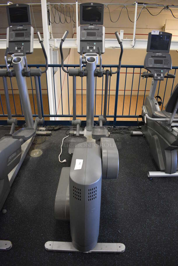 NICE! Precor Model 95xi Experience Metal Floor Style Elliptical Cross Trainer Machine w/ Life Fitness Model LCD-0201 Monitor. BUYER MUST REMOVE. 33x85x75. Tested and Working! (upstairs) This Unit Will Be Moved Down To The First Floor Before Pick Up Day Begins!