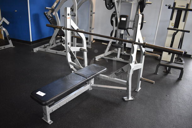 NICE! Hammer Strength Gray Metal Floor Style Flat Back Bench Press w/ Olympic Bar. BUYER MUST REMOVE - Unit May Need Disassembly For Removal. 67x63x51. (weight room) - Image 2 of 7