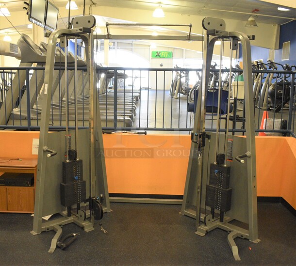 NICE! Metal Commercial Floor Style Functional Trainer Machine. BUYER MUST REMOVE - Unit May Need Disassembly For Removal. 96x60x83. (upstairs) This Unit Will Be Moved Down To The First Floor Before Pick Up Day Begins!
