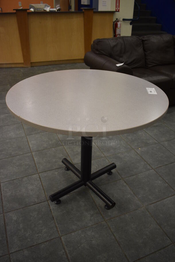 Gray Round Table on Metal Table Base. 36x36x30. (lobby)