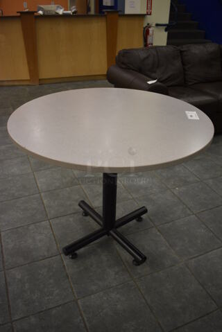 Gray Round Table on Metal Table Base. 36x36x30. (lobby)
