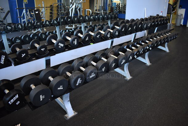 Hammer Strength White and Black Metal Floor Style 2 Tier Dumbbell Rack. Does Not Include Contents. BUYER MUST REMOVE. 90x24x33. (weight room) - Image 1 of 4