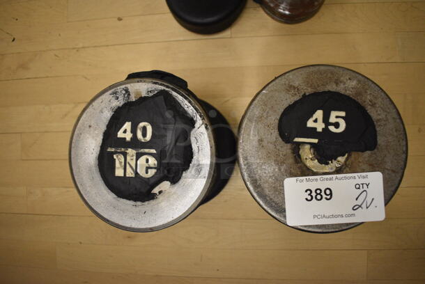 2 Black and Chrome Finish Metal Dumbbells. 40 Pounds and 45 Pounds. BUYER MUST REMOVE. 8x10.5x8. 2 Times Your Bid! (behind squash court - left) - Image 2 of 2