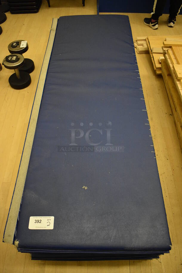 2 Blue Exercise Mats. 72x24x1.5. 2 Times Your Bid! (behind squash court - left)