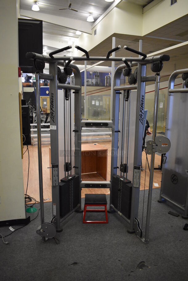 Life Fitness Model CMDAP Gray Metal Floor Style Dual Adjustable Pulley Functional Trainer Machine. BUYER MUST REMOVE - Unit May Need Disassembly For Removal. 64x48x93. (lobby) - Image 2 of 11