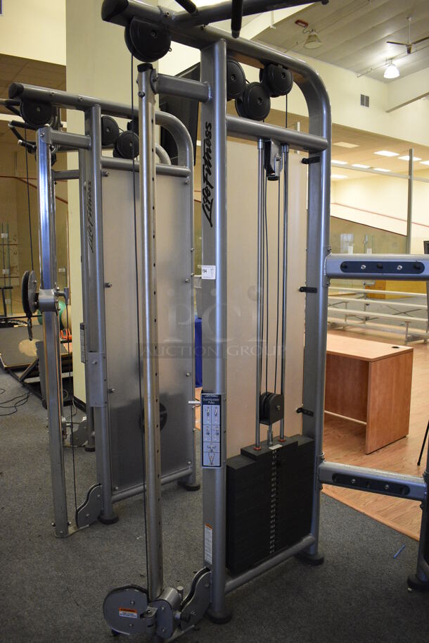 Life Fitness Model CMDAP Gray Metal Floor Style Dual Adjustable Pulley Functional Trainer Machine. BUYER MUST REMOVE BUYER MUST REMOVE - Unit May Need Disassembly For Removal. 64x48x93. (lobby) - Image 2 of 12