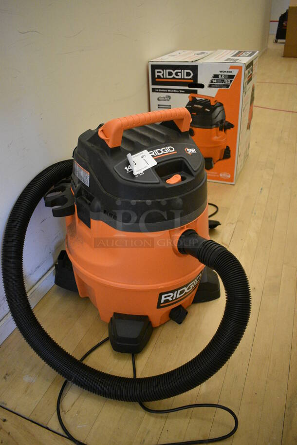 Rigid Orange and Black Wet and Dry Shop Vac Vacuum Cleaner. 19x19x24. (behind squash court - right)