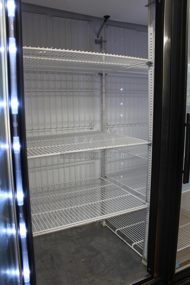 FANTASTIC! True Model GDM-49F-LD Commercial Double Glass Door Lighted Freezer Merchandiser On Commercial Casters. 53.5x30x83. Hardwired! 115/208-230V. 60Hz. 1 Phase. Tested And Working! Buyer Must Remove.Shipping Is Not Available.  - Image 2 of 5