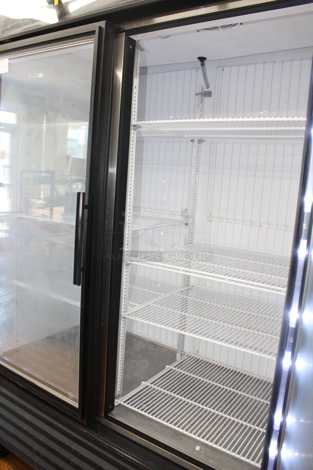 FANTASTIC! True Model GDM-49F-LD Commercial Double Glass Door Lighted Freezer Merchandiser On Commercial Casters. 53.5x30x83. Hardwired! 115/208-230V. 60Hz. 1 Phase. Tested And Working! Buyer Must Remove.Shipping Is Not Available.  - Image 4 of 5