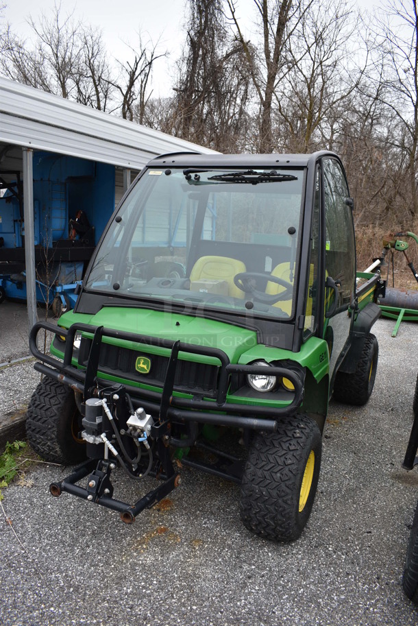 2007 John Deere Gator HPX 4x4 Gas Powered Utility Vehicle. Comes w/ Snow Plow Attachment Not Shown In Pictures! 3,109 Hours. Vehicle Runs and Drives! See Lot #12 For Additional Pictures. 52x120x74. This Item Needs To Be Removed On Pick Up Day: 2/10/21 - Image 1 of 12