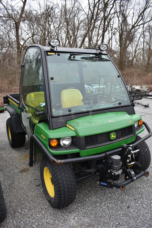 2009 John Deere Gator XUV 620i 4x4 Gas Powered Utility Vehicle. Comes w/ Snow Plow Attachment That Is Not Shown In Pictures! 2,184 Hours. Vehicle Runs and Drives! See Lot #14 For Additional Pictures. 62x120x74. This Item Needs To Be Removed On Pick Up Day: 2/10/21
