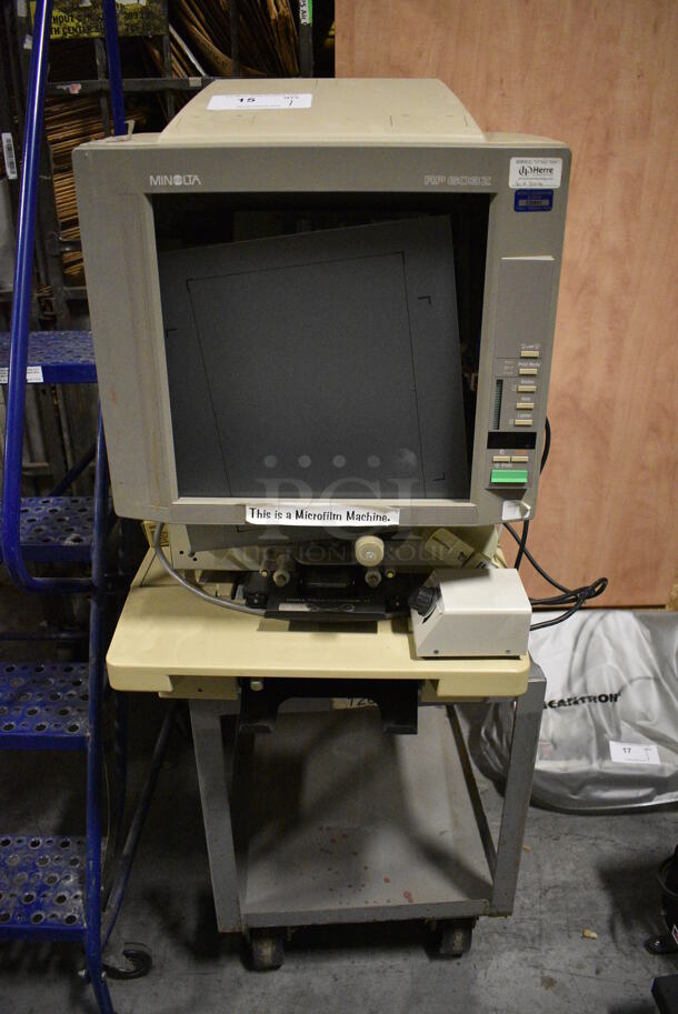 Minolta Model RP603Z Microfilm Machine on Metal Cart. 120 Volts, 1 Phase. 19x34x30, 18.5x30.5x39. (facilities)