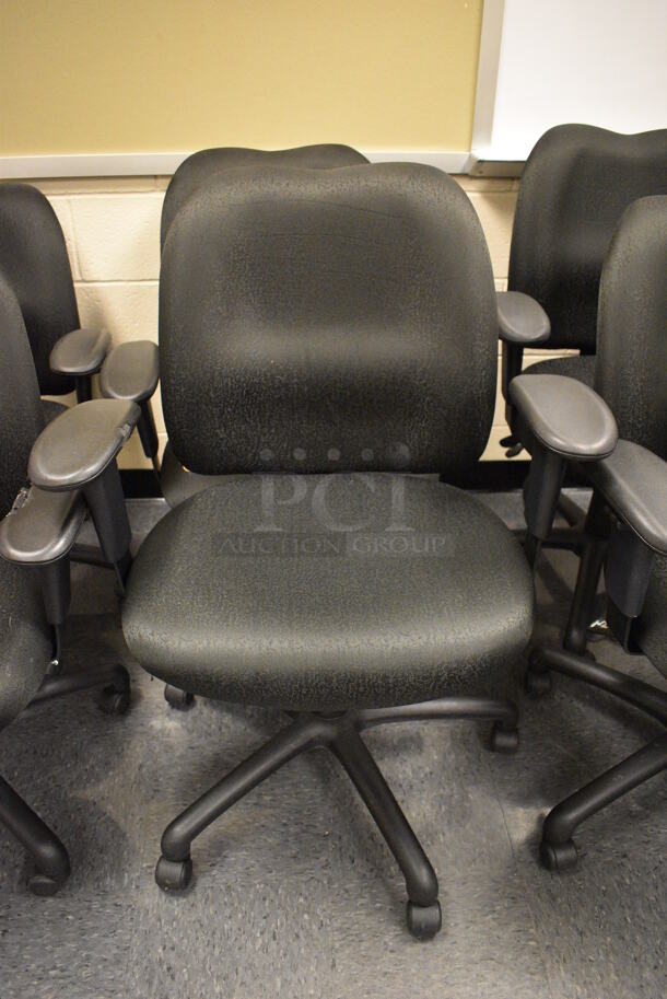 5 Black Office Chairs w/ Arm Rests on Casters. Stock Picture - Cosmetic Condition May Vary. 24x21x39. 5 Times Your Bid! (John N. Hall Tech - Room 106)