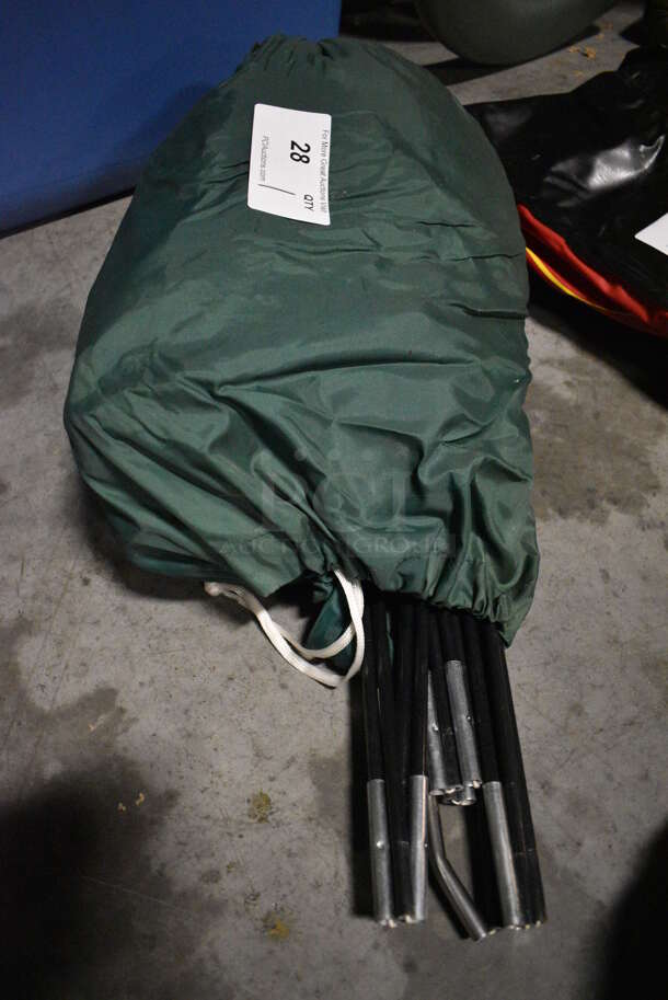 Green Bag w/ Tent and Poles Inside. 16x9x9. (facilities)