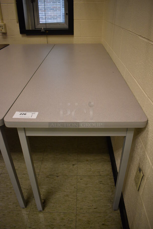 Table. 71.5x23.5x29. (John N. Hall Tech - Room 108)