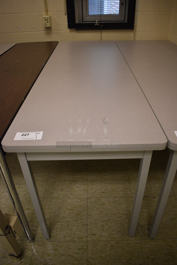 Table. 71.5x23.5x29. (John N. Hall Tech - Room 108)