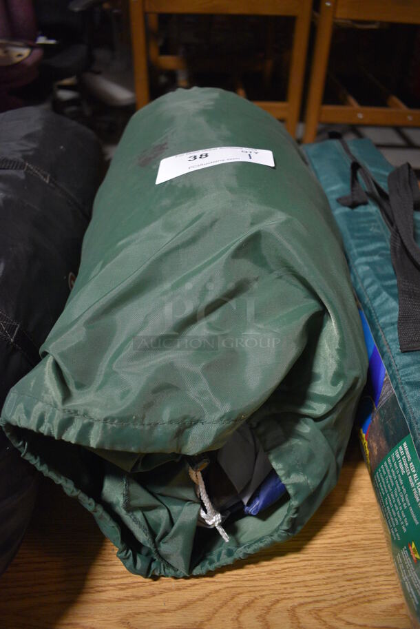 Green Bag w/ Tent. 20x9x9. (facilities)