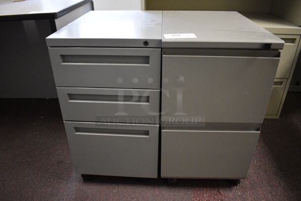 2 Gray Filing Cabinets on Casters; One w/ 3 Drawers and One w/ 2 Drawers. 15x22x28. 2 Times Your Bid! (John N. Hall Tech - Room 122 Office F)