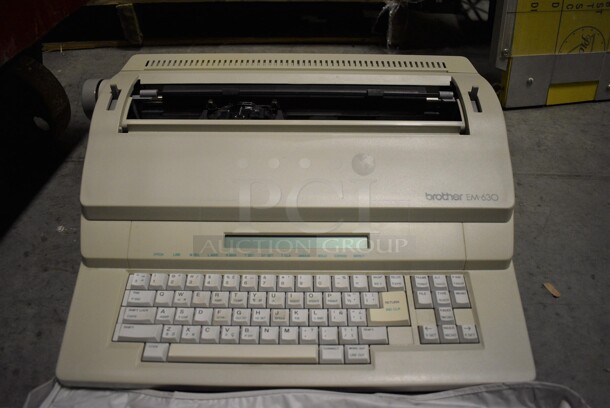 Brother EM-630 Countertop Typewriter w/ Cover. 20x17x6. (facilities) - Image 1 of 6