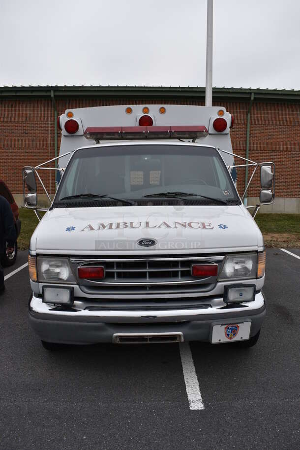 1998 Braun Ford E-Super Duty Power Stroke Diesel Ambulance w/ Additional Air Conditioning In Rear Compartment and 6 Exterior Cabinets. Odometer Reads 105,207. VIN 1FDXE40F4XHA22974. Title In Hand. Vehicle Runs and Drives! See Lot #2 For Additional Pictures. This Item Needs To Be Removed On Pick Up Day: 2/10/21 - Image 2 of 12